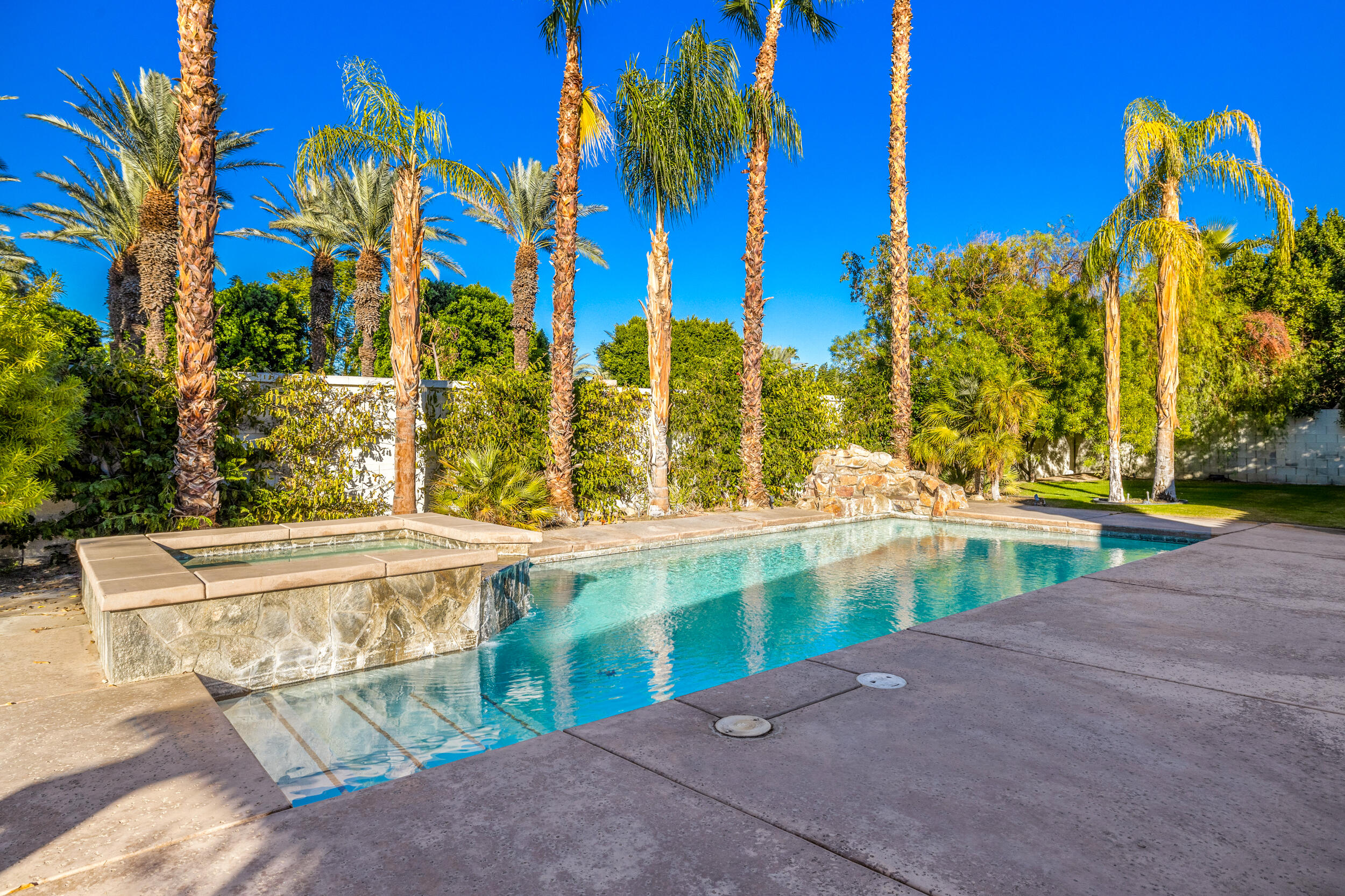 8 Trafalgar Rancho Mirage, CA 92270 - Photo 35 of 41 a view of a swimming pool with a patio