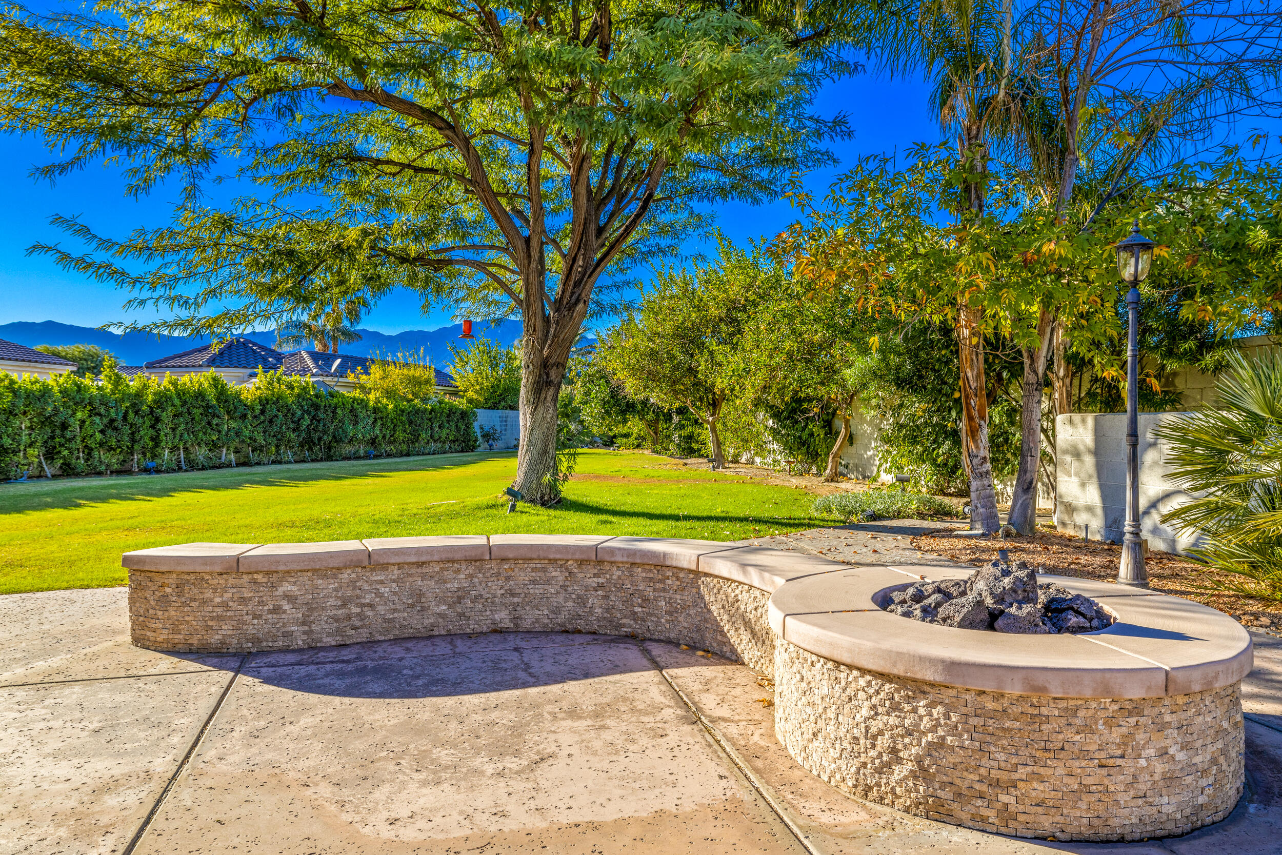 8 Trafalgar Rancho Mirage, CA 92270 - Photo 36 of 41 a view of a swimming pool with a yard