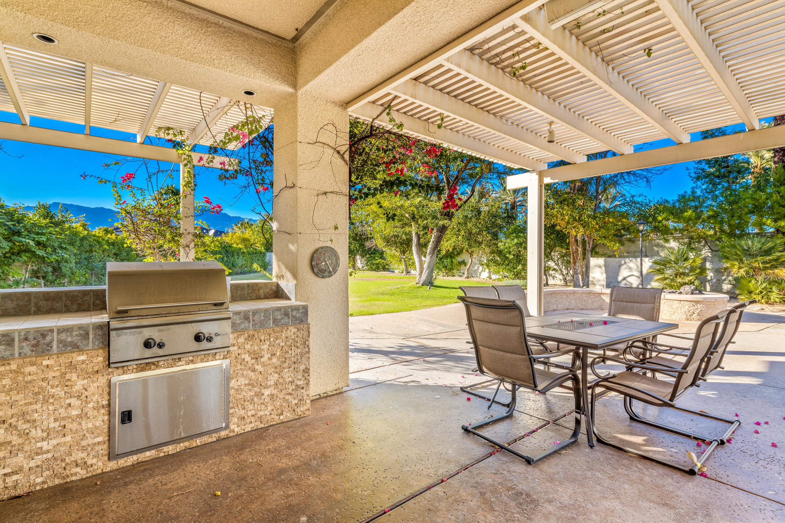 8 Trafalgar Rancho Mirage, CA 92270 - Photo 38 of 41 a view of a patio with a table and chairs