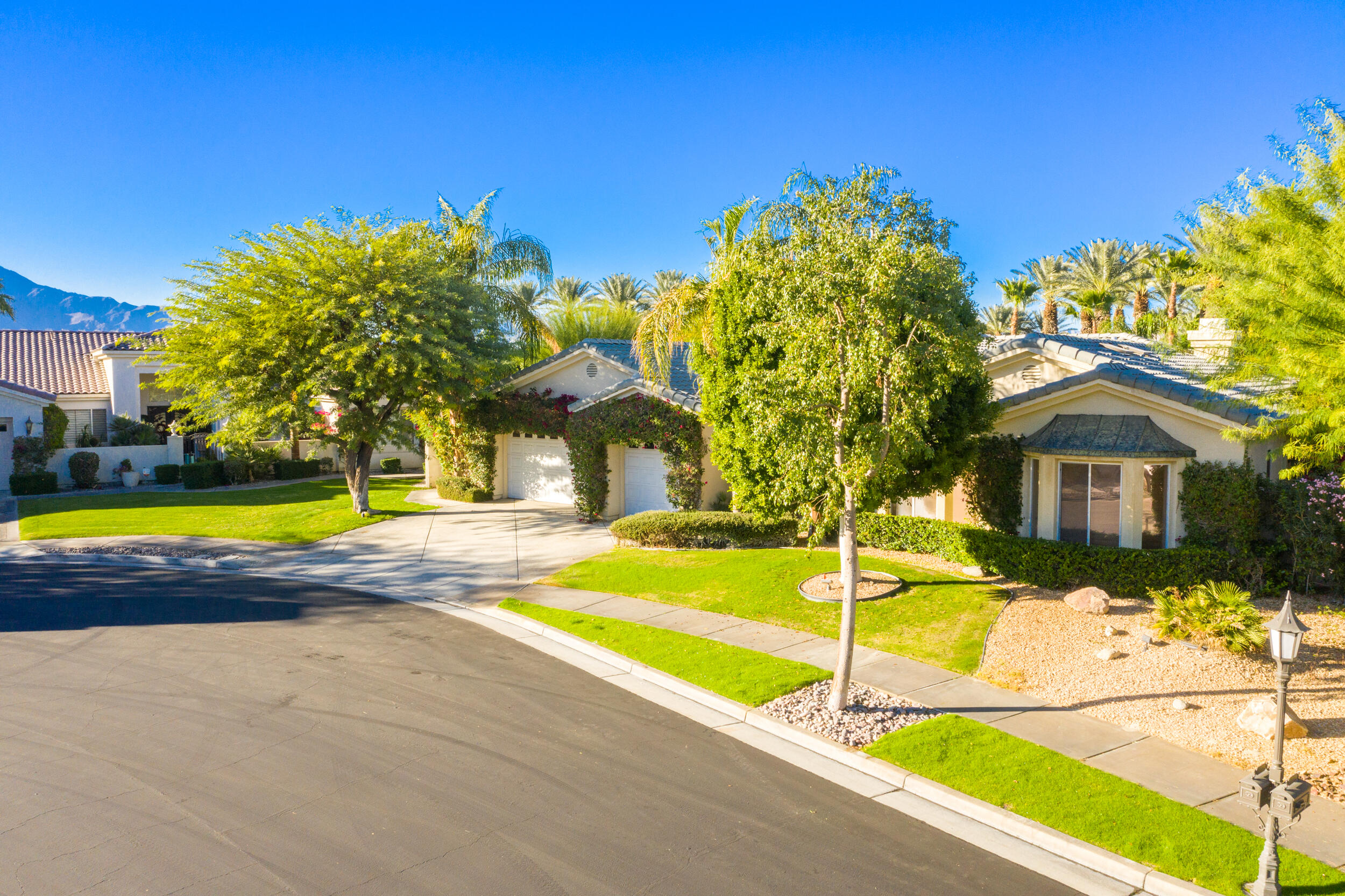 8 Trafalgar Rancho Mirage, CA 92270 - Photo 39 of 41 a view of swimming pool with a house in the background