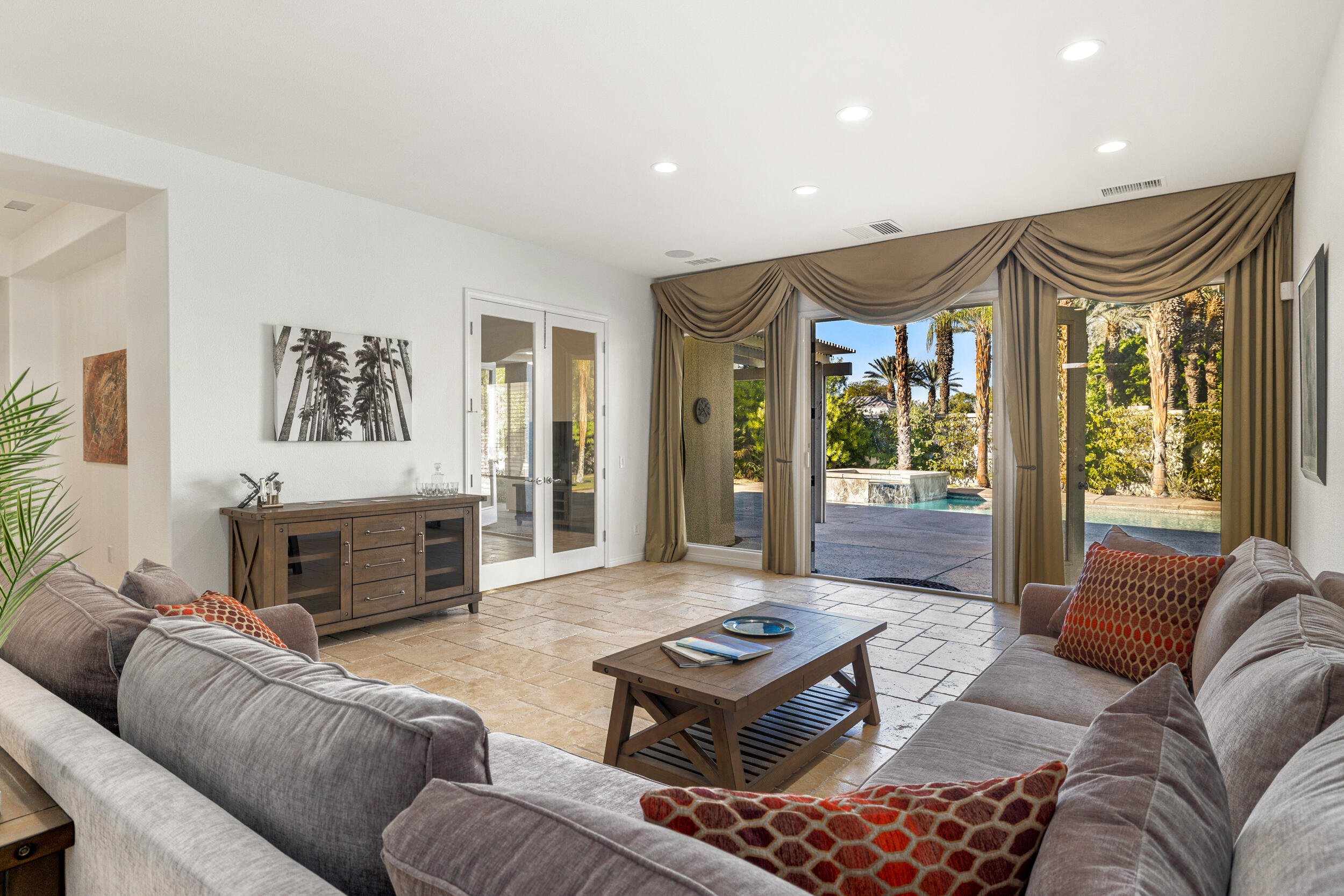 8 Trafalgar Rancho Mirage, CA 92270 - Photo 8 of 41 a living room with furniture and a fireplace