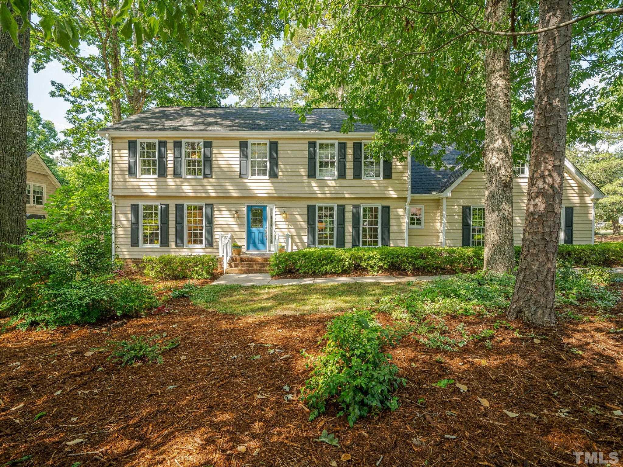 5029 Trail Ridge Drive Raleigh, NC 27613 - Photo 1 of 37 a front view of a house with a yard