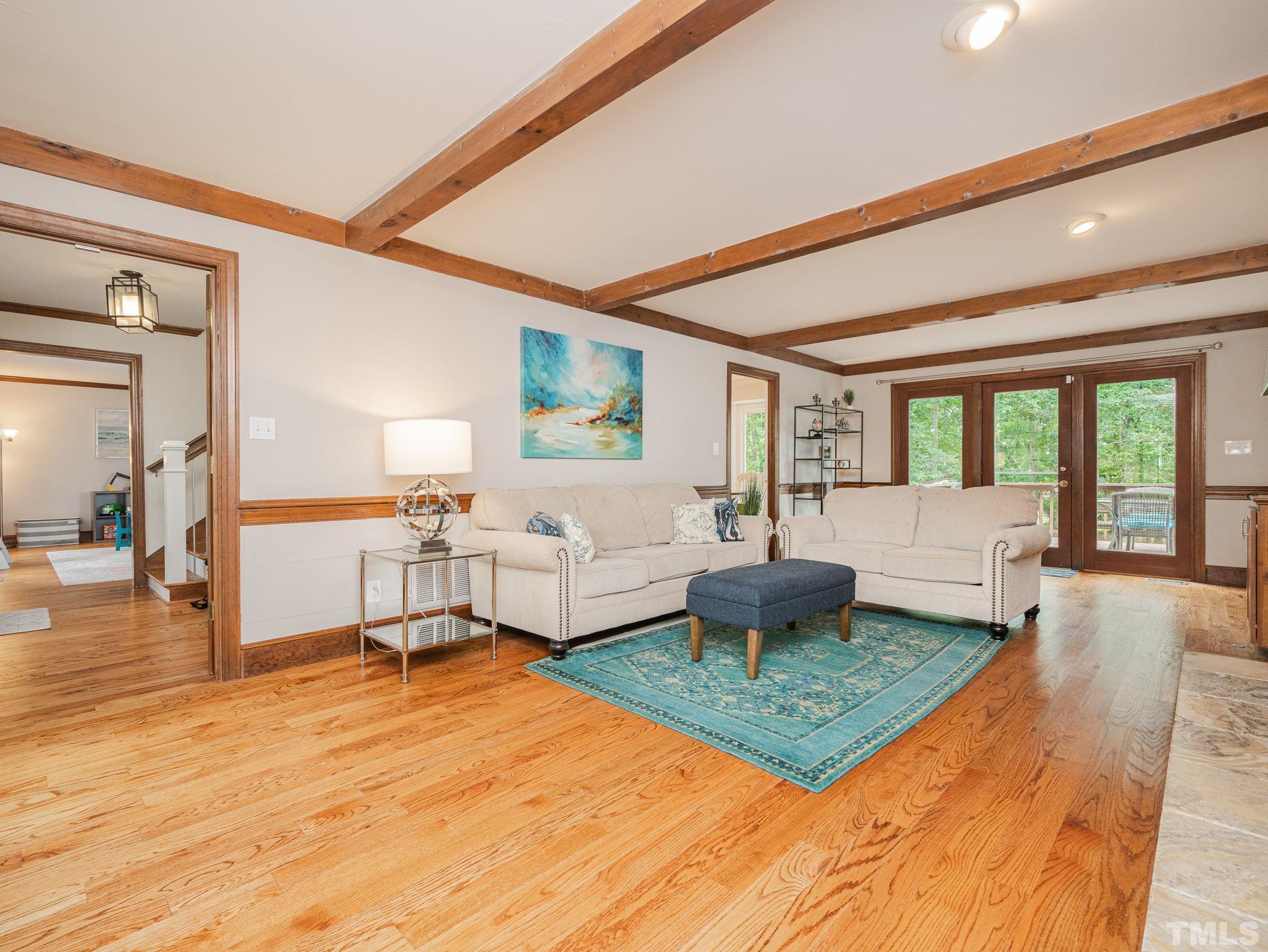 5029 Trail Ridge Drive Raleigh, NC 27613 - Photo 11 of 37 a living room with furniture and a table
