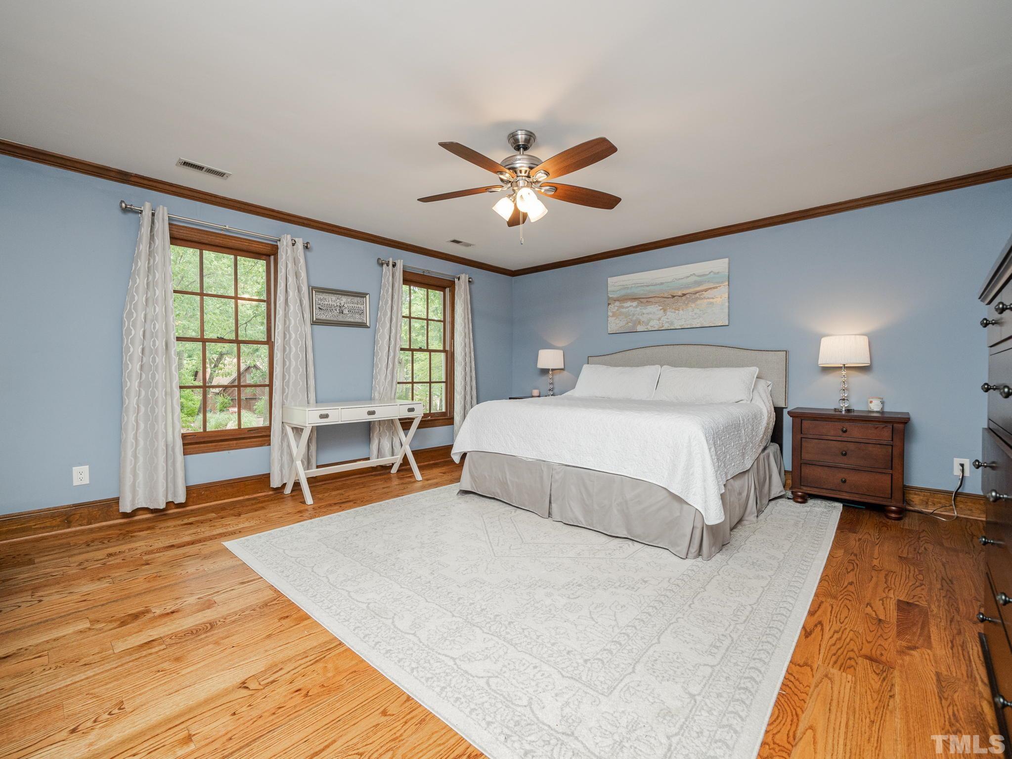 5029 Trail Ridge Drive Raleigh, NC 27613 - Photo 14 of 37 a spacious bedroom with a large bed and a large window