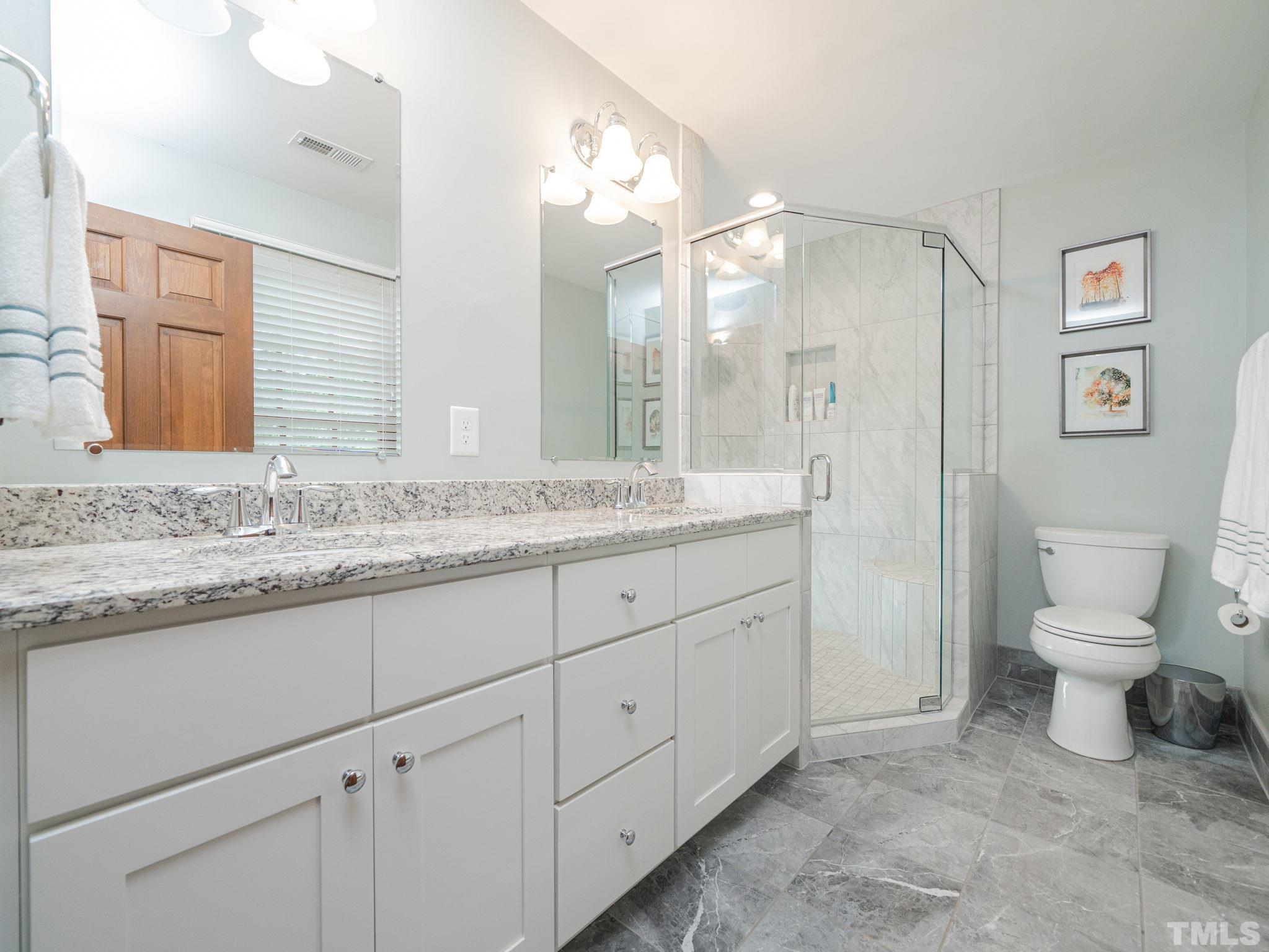 5029 Trail Ridge Drive Raleigh, NC 27613 - Photo 15 of 37 a bathroom with a granite countertop sink mirror and toilet