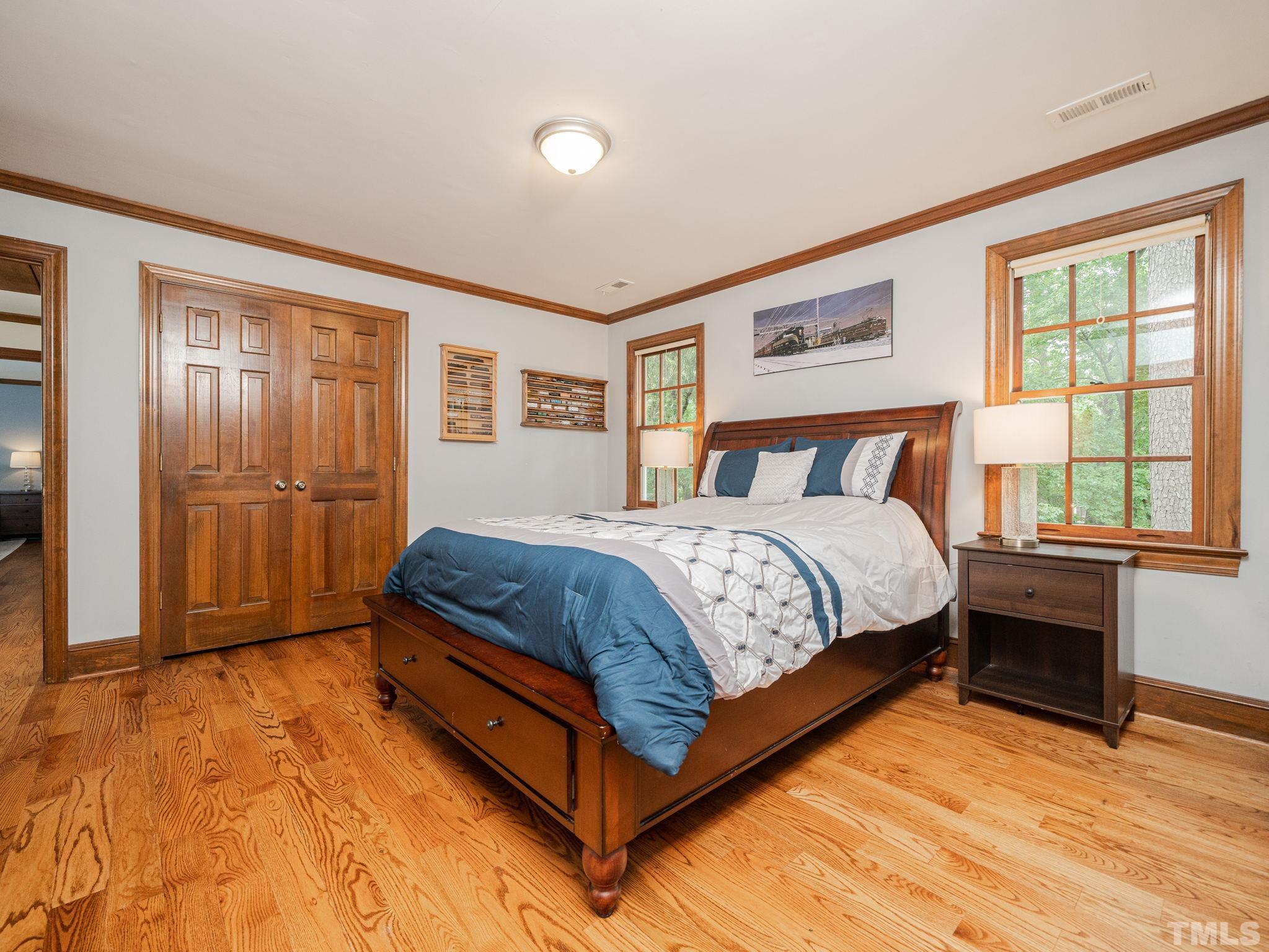 5029 Trail Ridge Drive Raleigh, NC 27613 - Photo 17 of 37 a bedroom with a bed and window