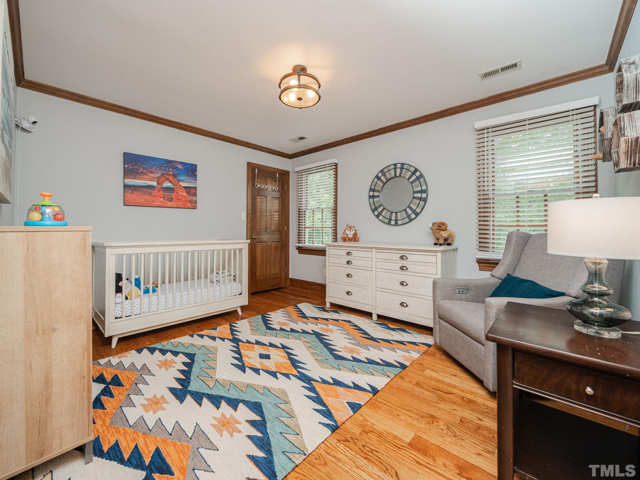 5029 Trail Ridge Drive Raleigh, NC 27613 - Photo 20 of 37 a bedroom with furniture and a window