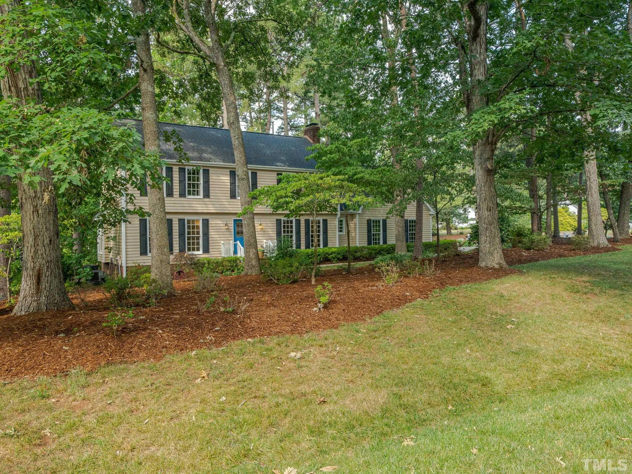 5029 Trail Ridge Drive Raleigh, NC 27613 - Photo 25 of 37 a front view of a house with a yard