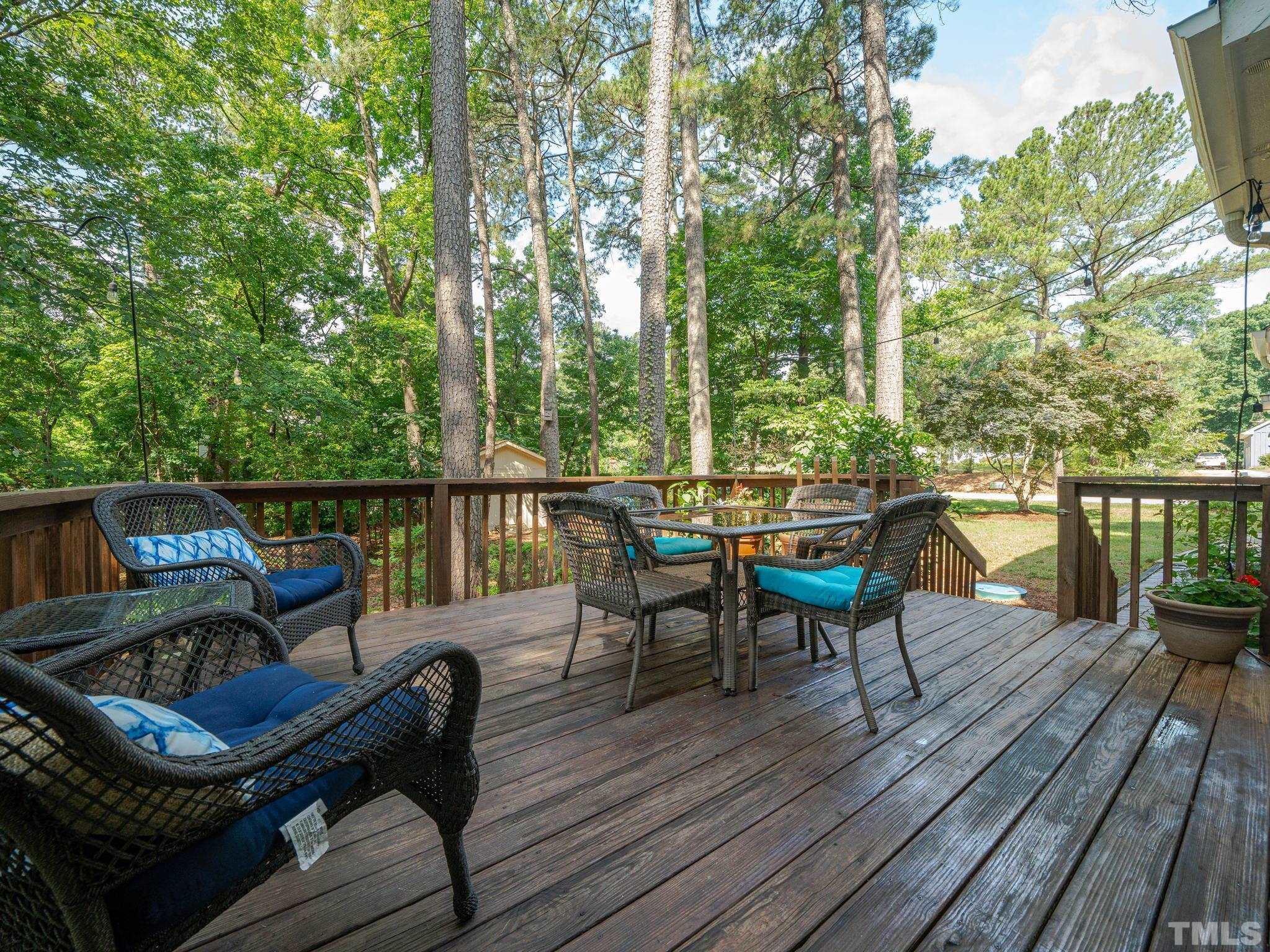 5029 Trail Ridge Drive Raleigh, NC 27613 - Photo 28 of 37 a view of a balcony with chairs and wooden floor