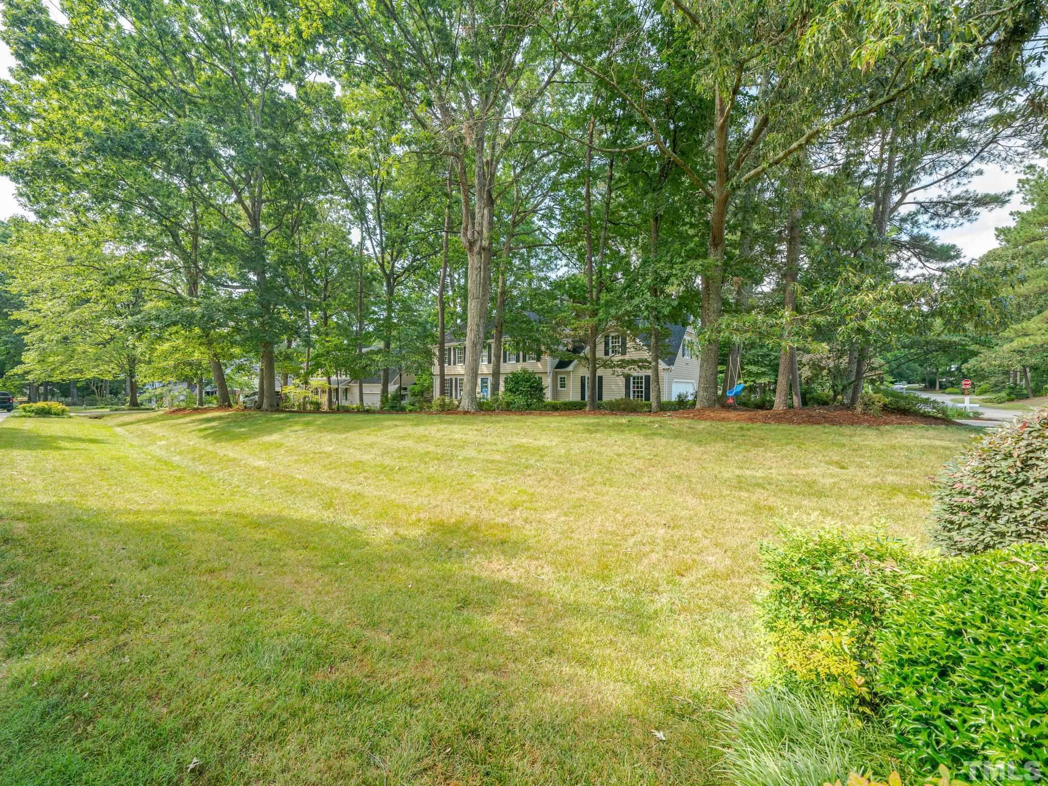 5029 Trail Ridge Drive Raleigh, NC 27613 - Photo 34 of 37 a view of a yard with a trees