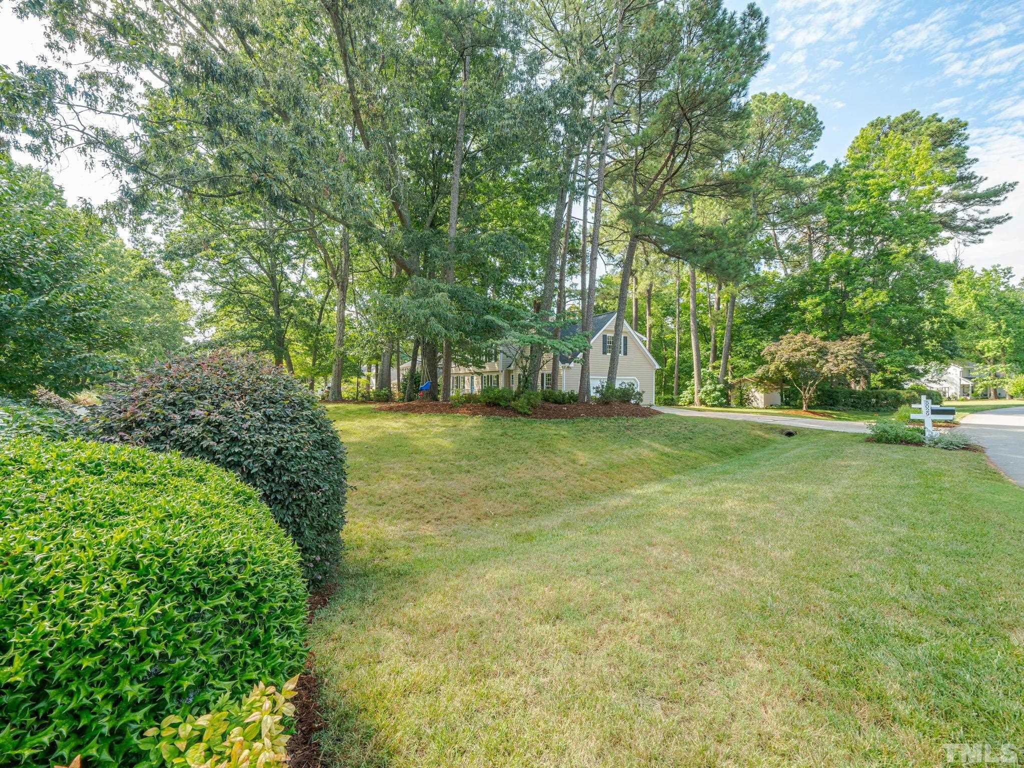 5029 Trail Ridge Drive Raleigh, NC 27613 - Photo 35 of 37 a view of a field with trees