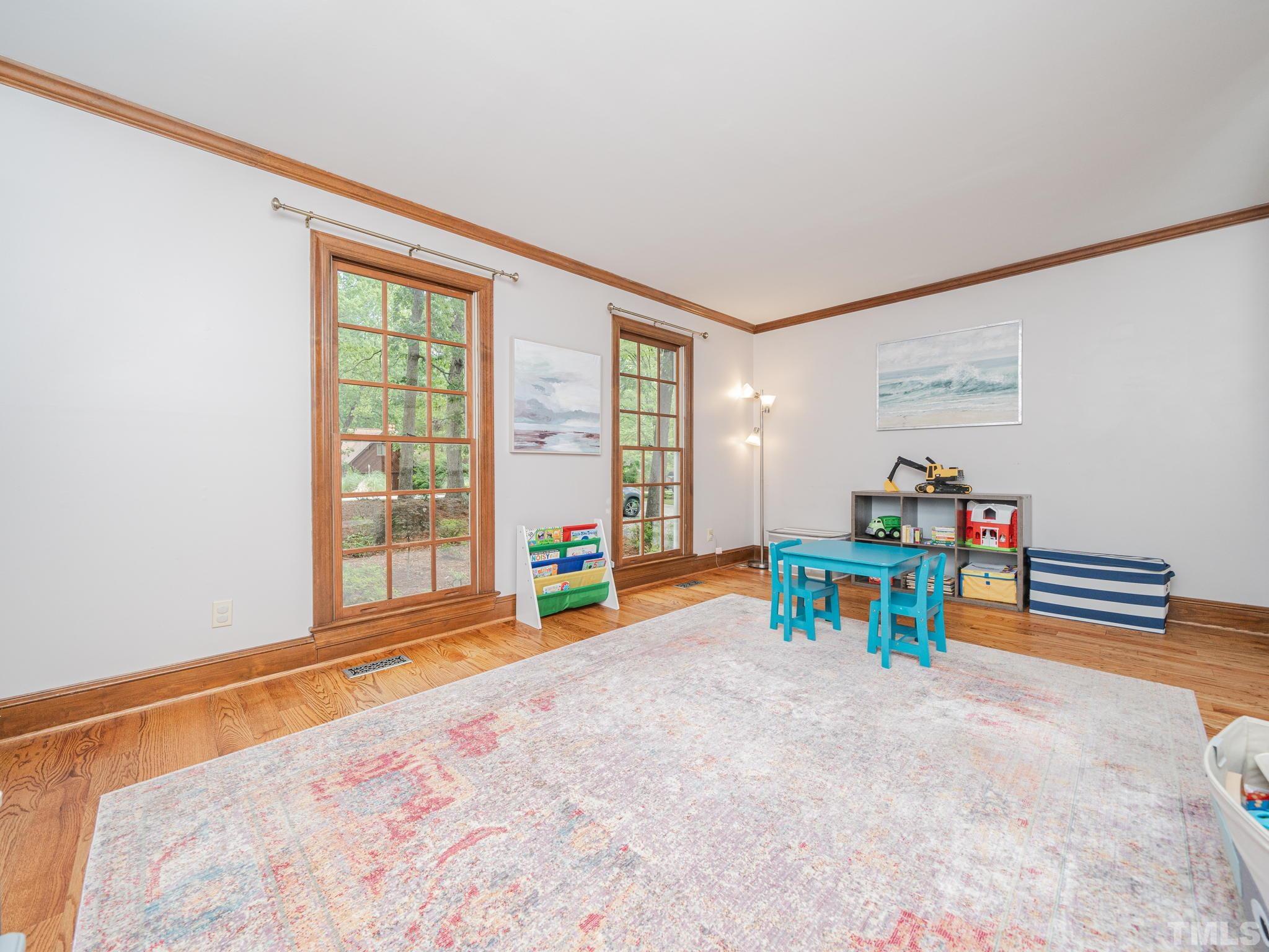 5029 Trail Ridge Drive Raleigh, NC 27613 - Photo 8 of 37 a bedroom with furniture and a large window