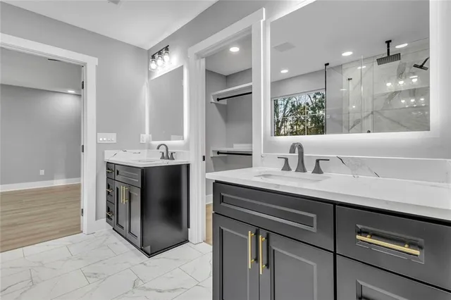 a spacious bathroom with a sink double vanity and a mirror