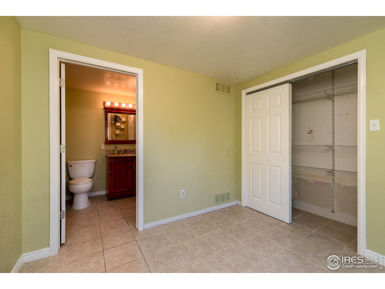 6778 Olde Stage Road Boulder, CO 80302 - Photo 22 of 40 Main level bedroom and ensuite half bath