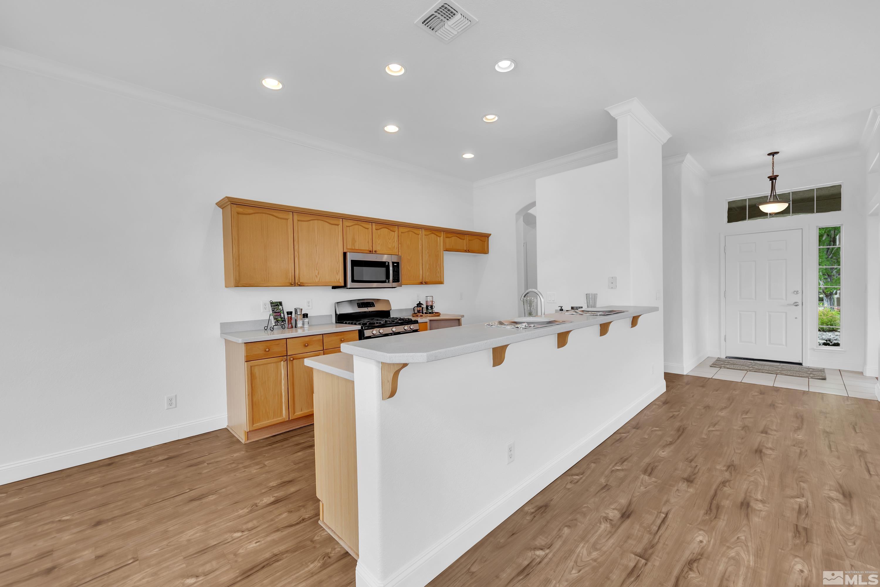10445 Arbor Way Reno, NV 89521 - Photo 14 of 39 a view of kitchen with sink and wooden floor