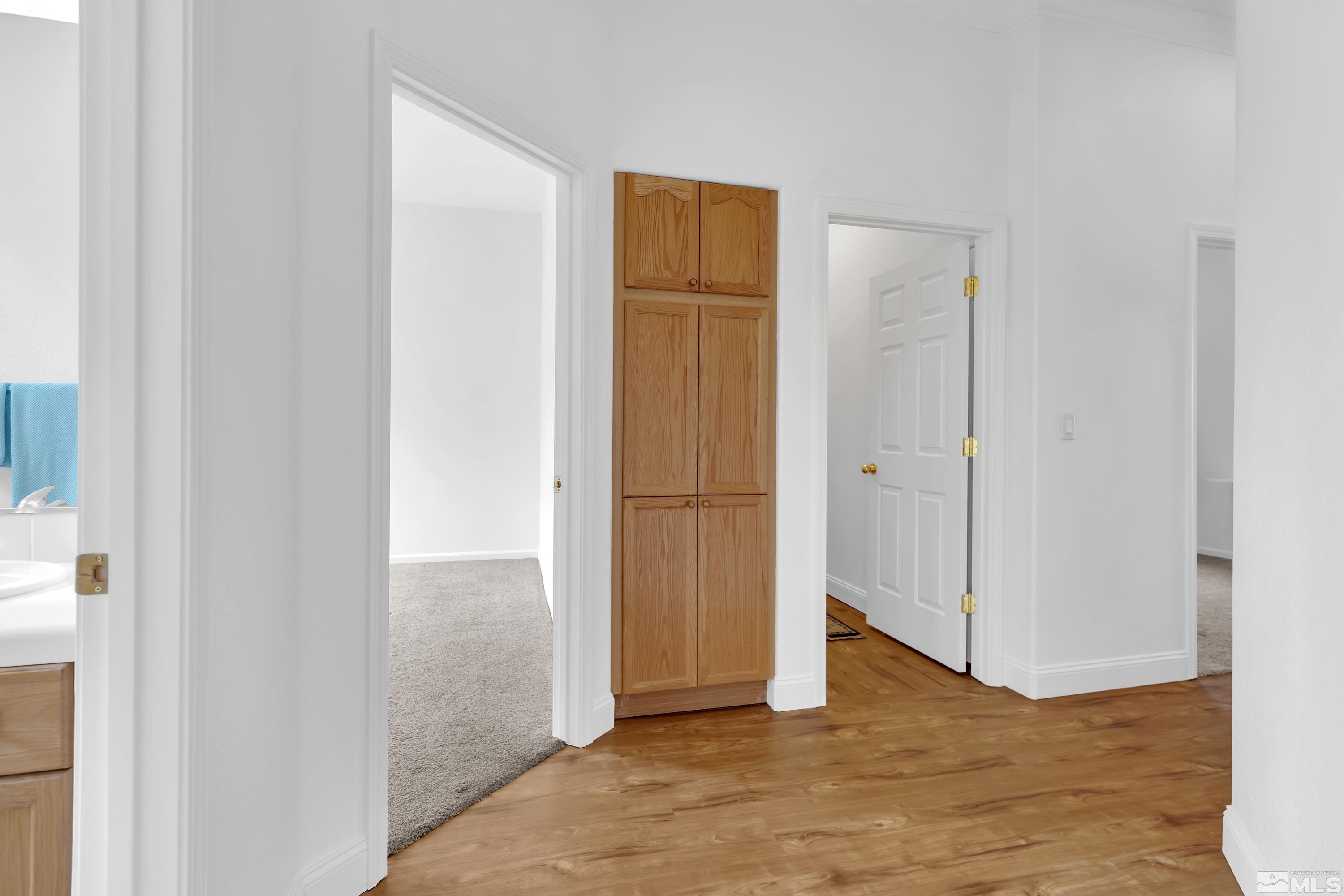 10445 Arbor Way Reno, NV 89521 - Photo 21 of 39 a view of an empty room with wooden floor
