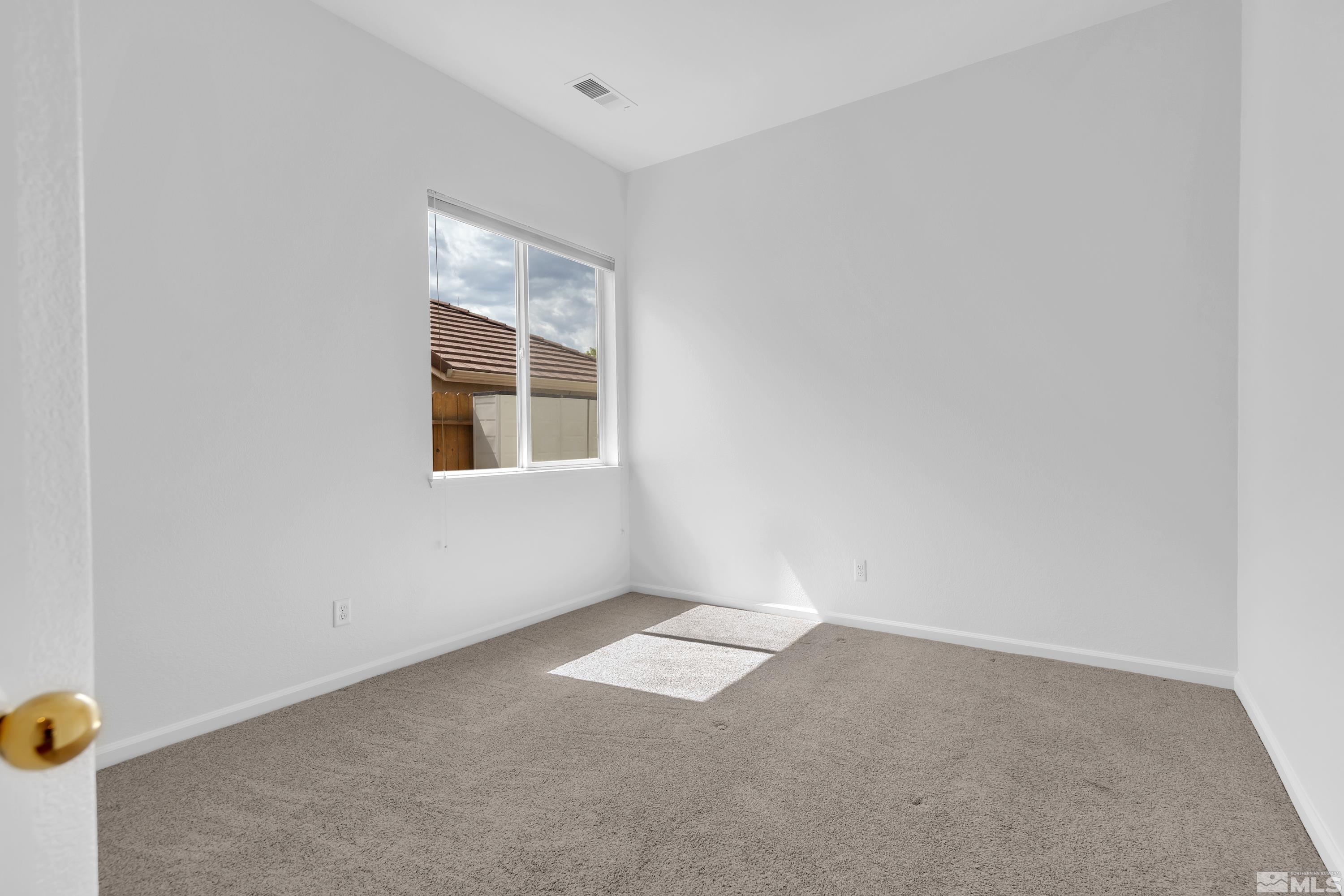 10445 Arbor Way Reno, NV 89521 - Photo 22 of 39 an empty room with a window