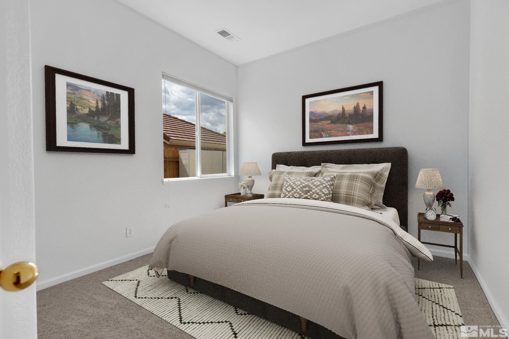 10445 Arbor Way Reno, NV 89521 - Photo 23 of 39 a bedroom with a bed and a painting on the wall