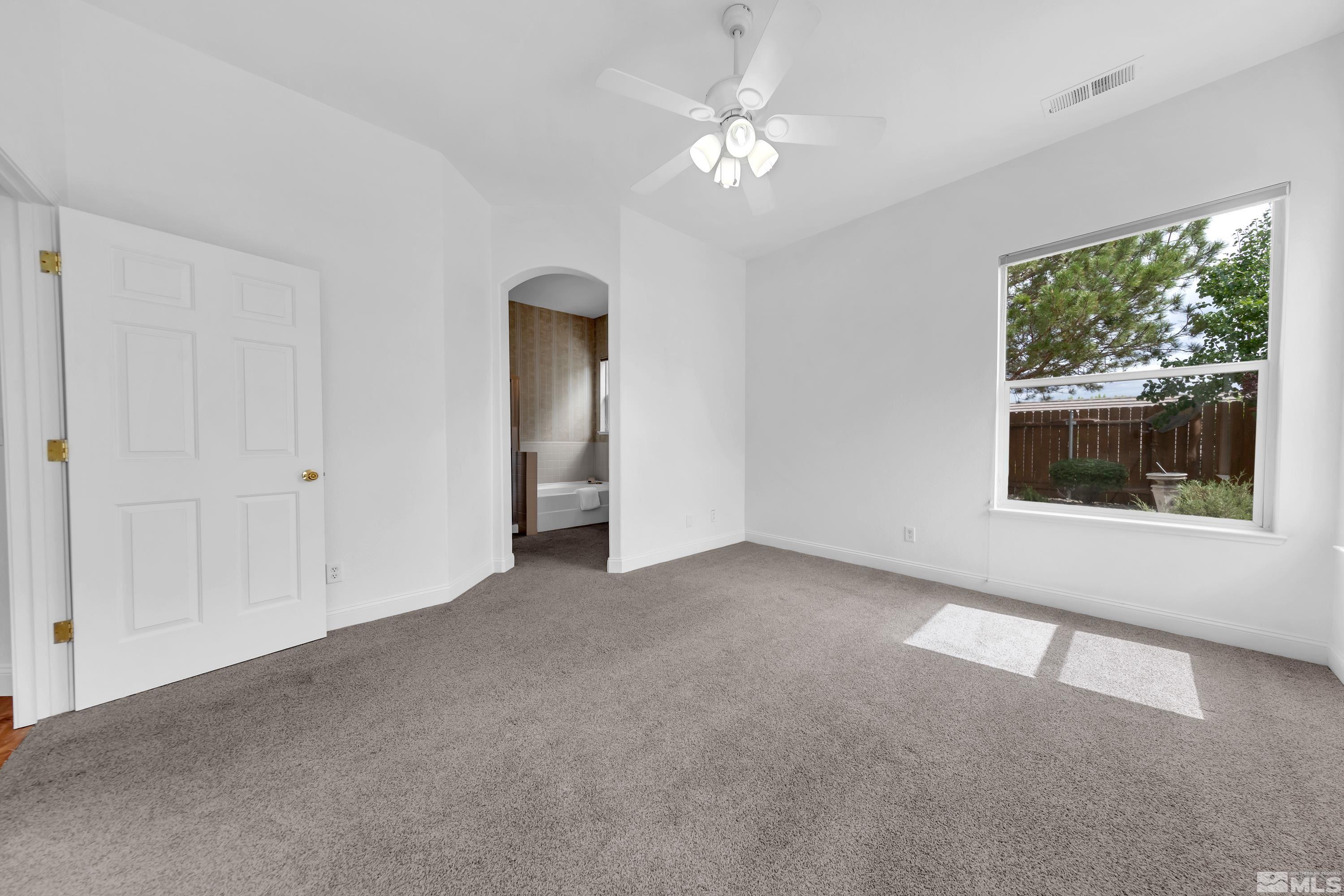 10445 Arbor Way Reno, NV 89521 - Photo 24 of 39 a view of a livingroom with an empty space and a window