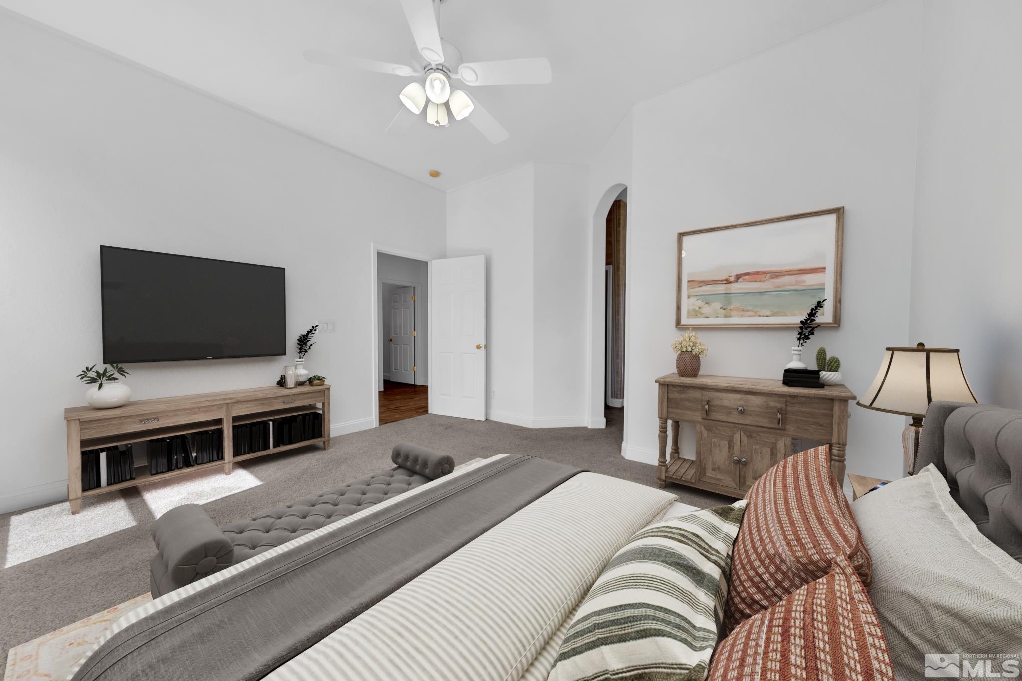 10445 Arbor Way Reno, NV 89521 - Photo 26 of 39 a bedroom with a bed and a flat screen tv