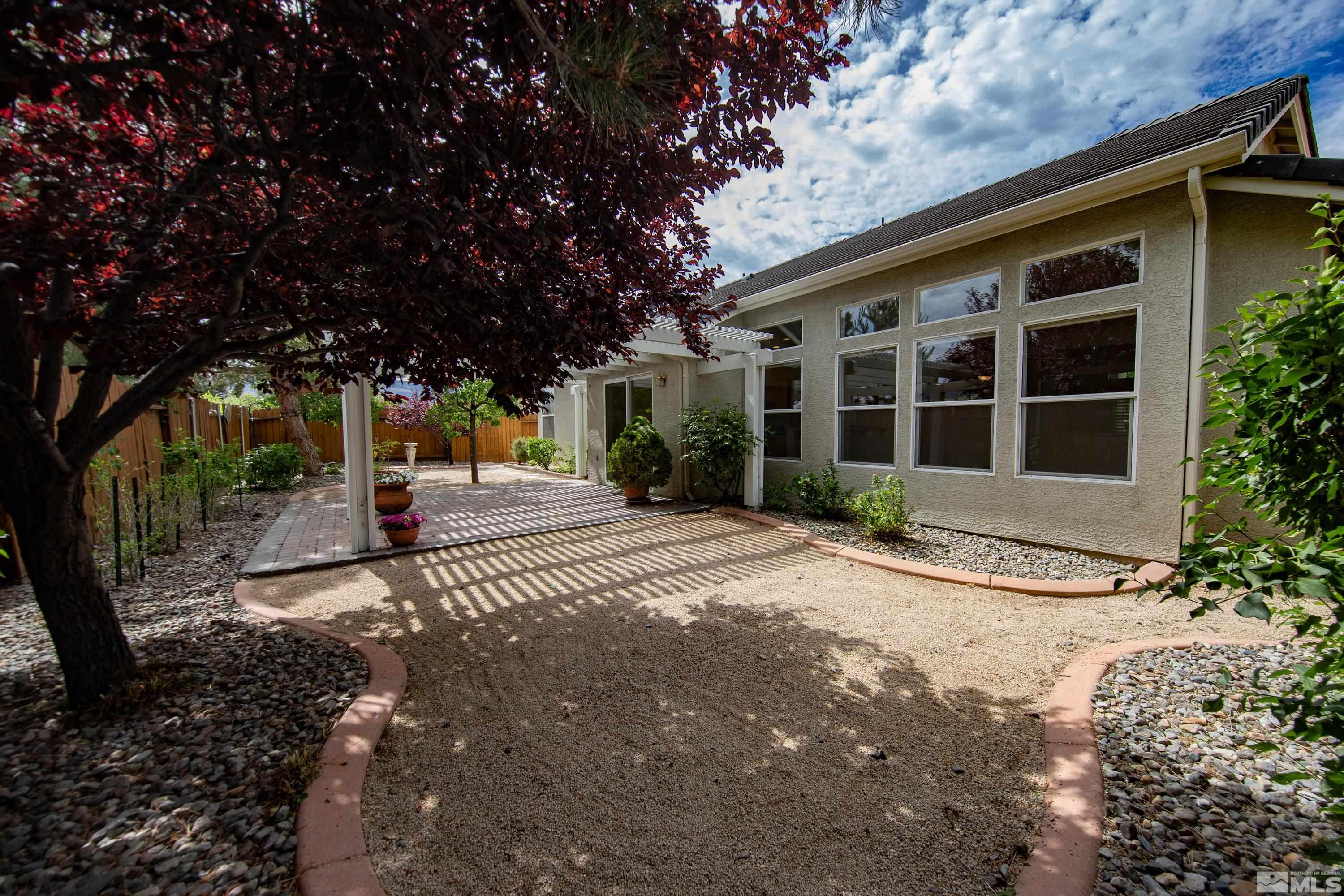 10445 Arbor Way Reno, NV 89521 - Photo 38 of 39 a view of a house with a yard