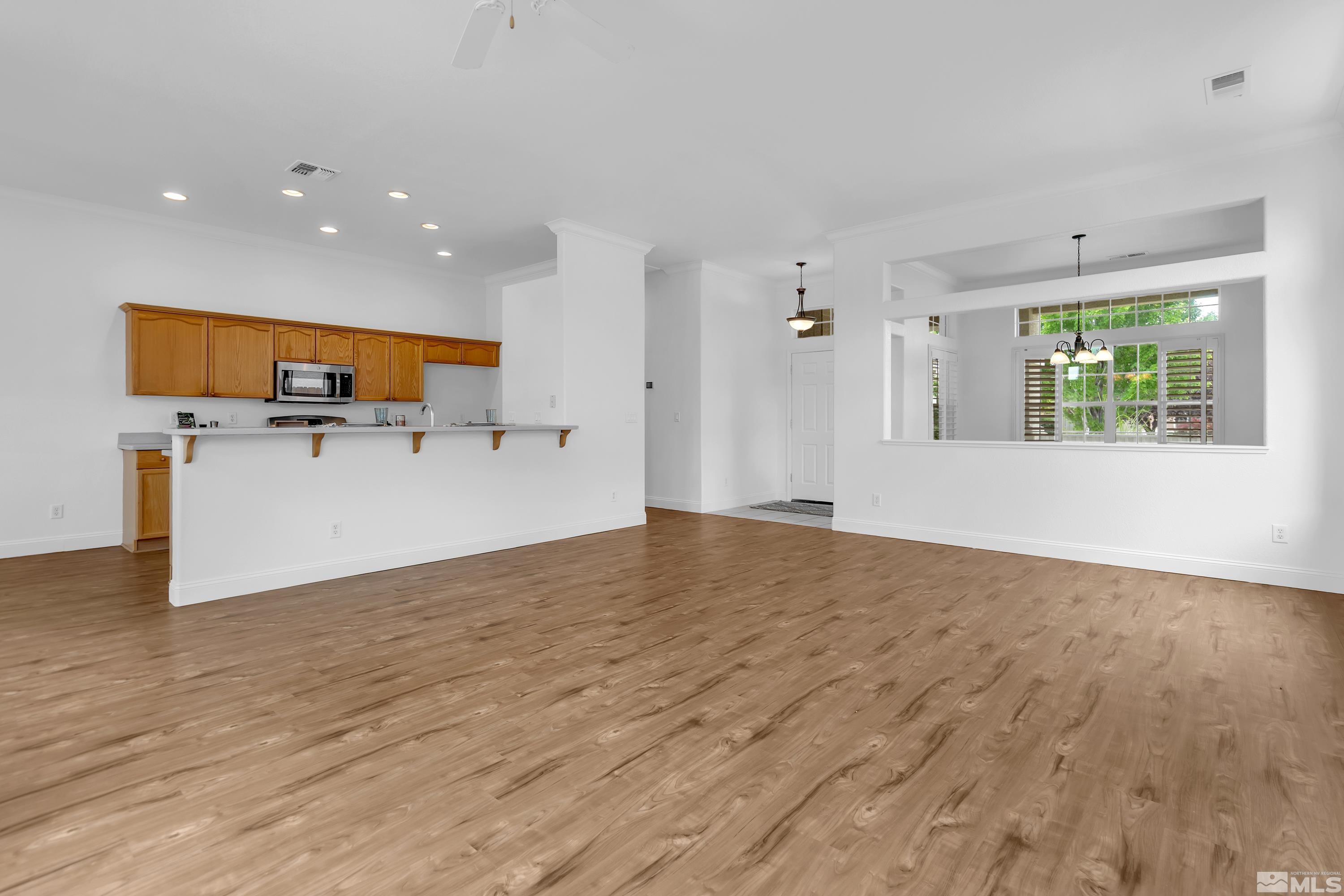 10445 Arbor Way Reno, NV 89521 - Photo 9 of 39 a view of empty room with wooden floor and window
