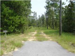 14 Richardson Road Crestview, FL 32539 - Photo 2 of 4 a view of a lake view with a garden
