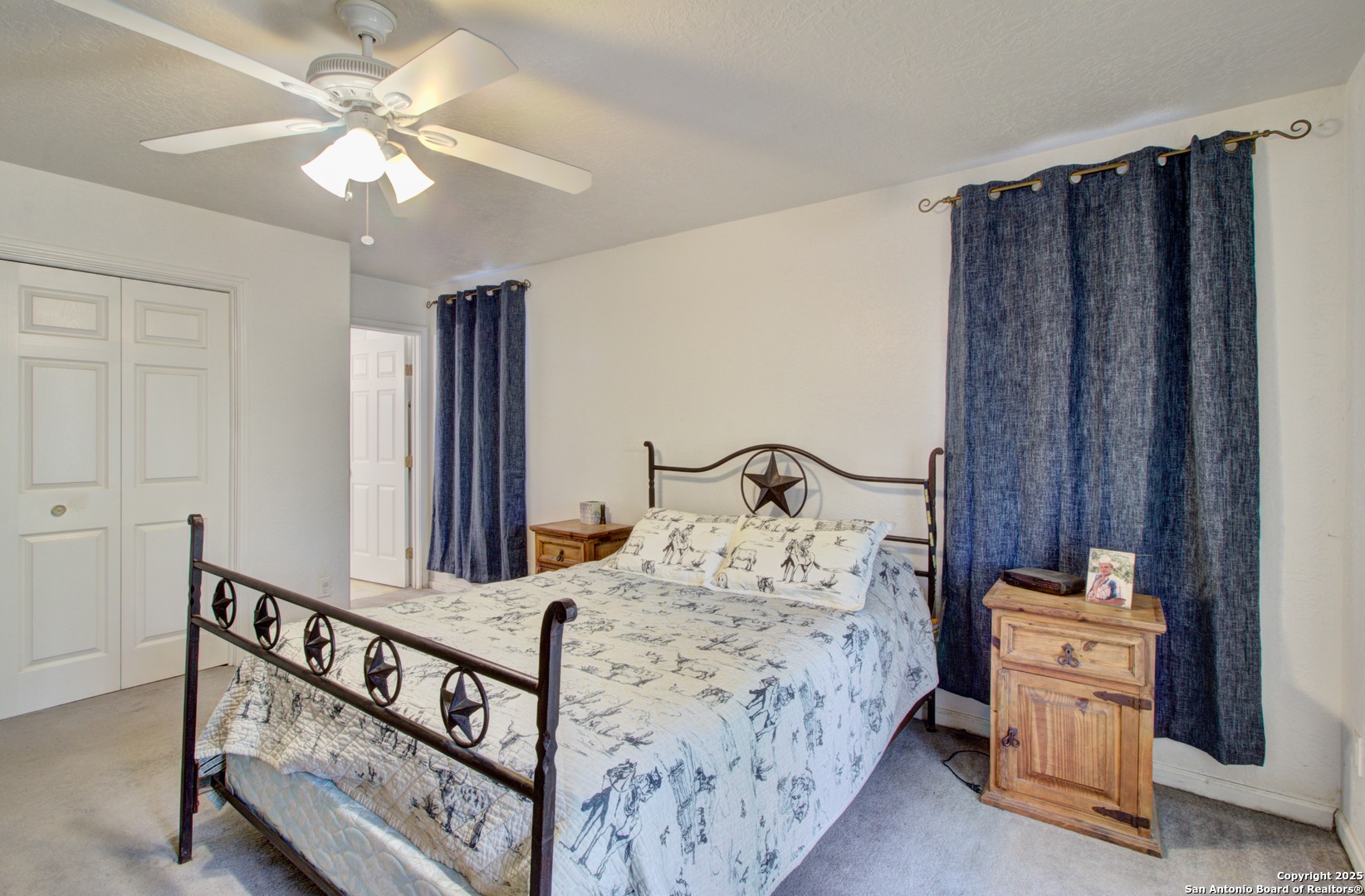 6248 Yorkshire Drive Spring Branch, TX 78070 - Photo 13 of 28 a bedroom with a bed a dresser and potted plants
