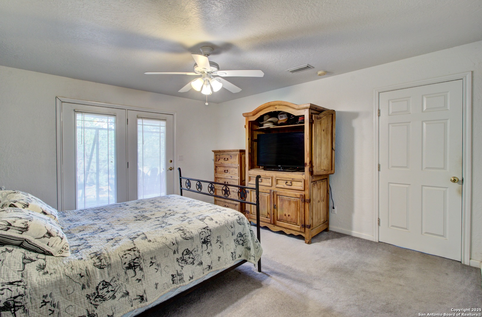 6248 Yorkshire Drive Spring Branch, TX 78070 - Photo 14 of 28 a bedroom with a bed and a flat screen tv