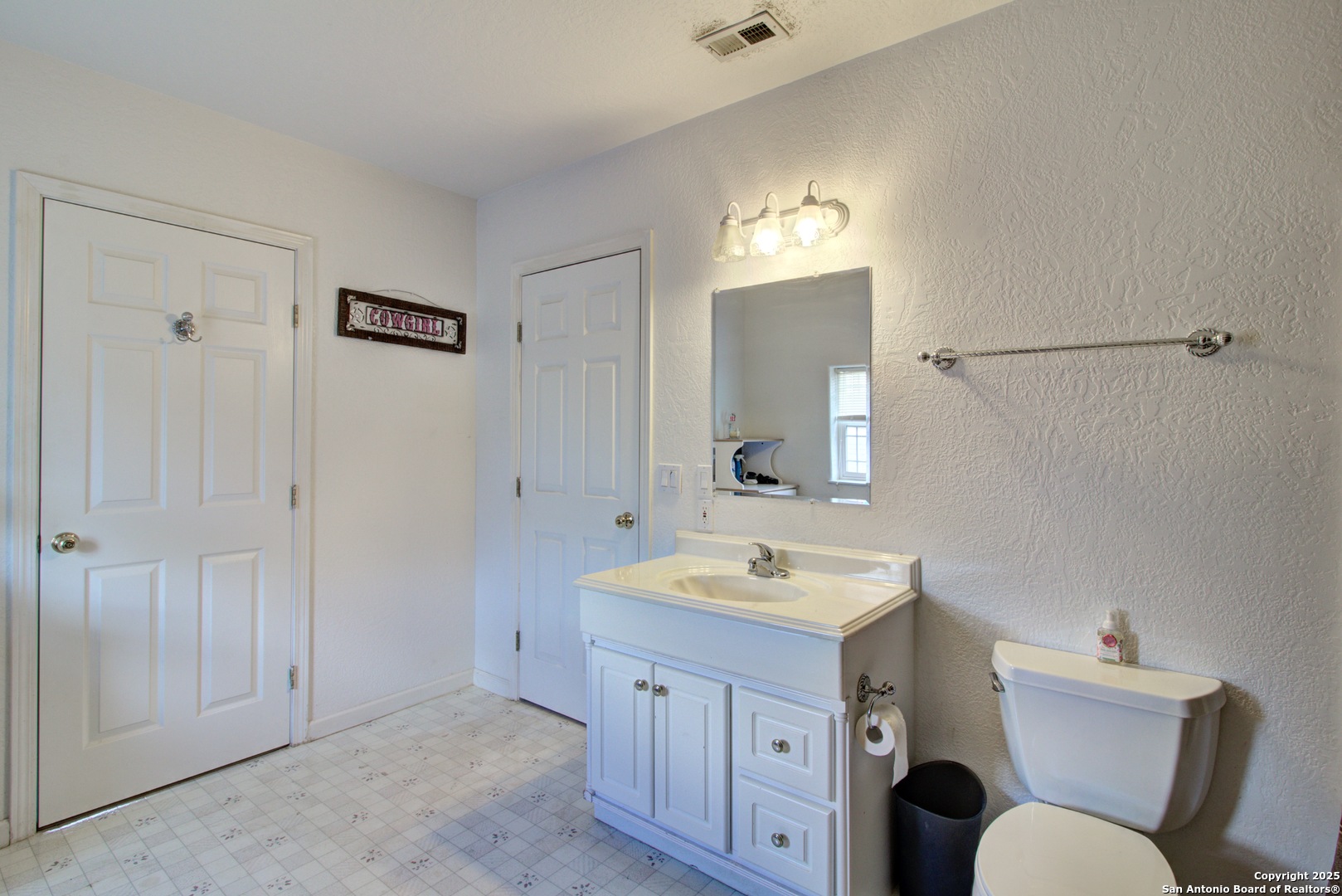 6248 Yorkshire Drive Spring Branch, TX 78070 - Photo 25 of 28 a spacious bathroom with a granite countertop sink toilet a mirror and shower