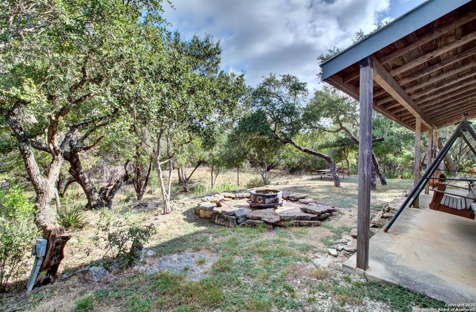 6248 Yorkshire Drive Spring Branch, TX 78070 - Photo 26 of 28 a backyard of a house with table and chairs