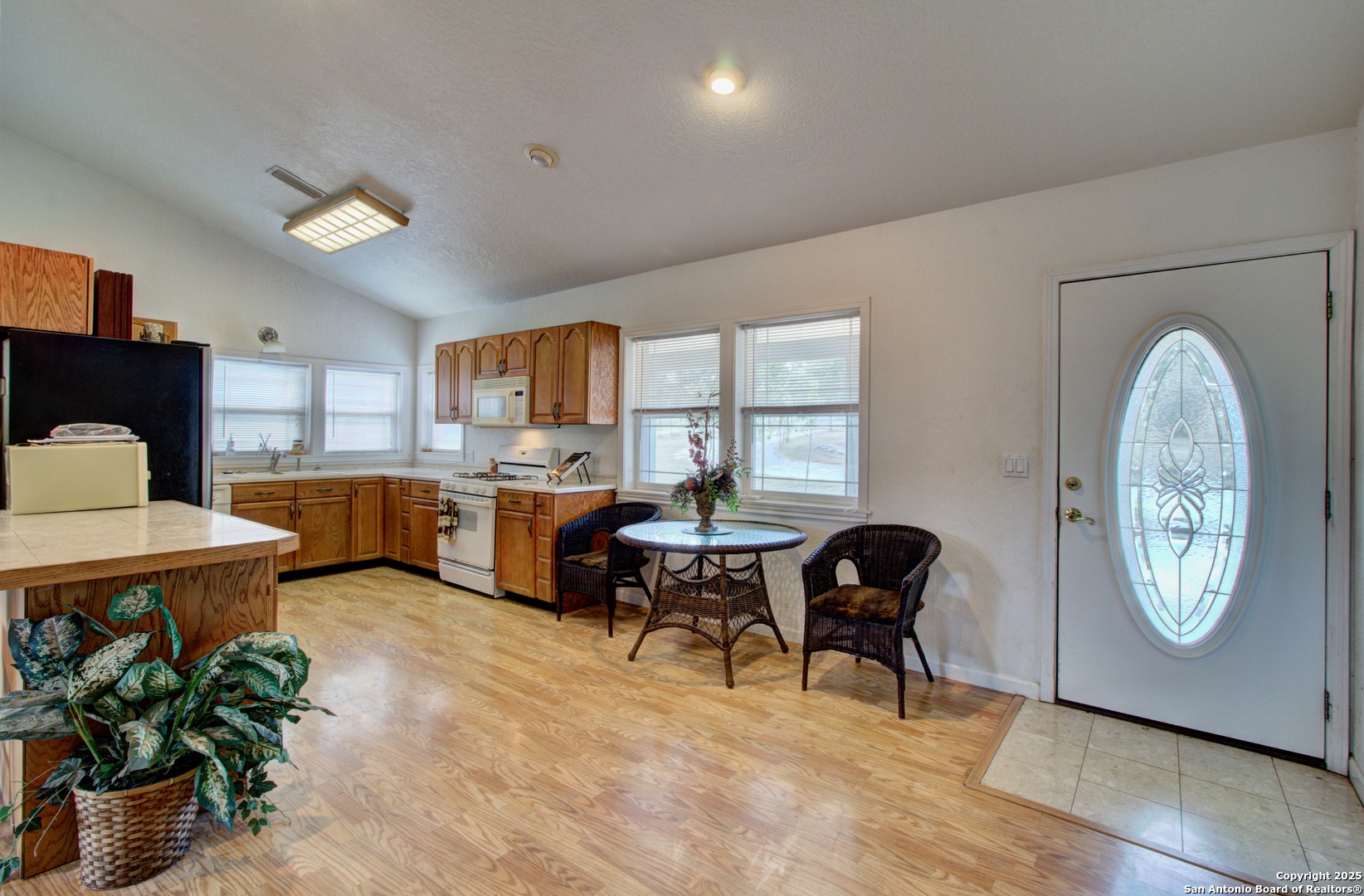 6248 Yorkshire Drive Spring Branch, TX 78070 - Photo 3 of 28 a living room with furniture a table and kitchen view