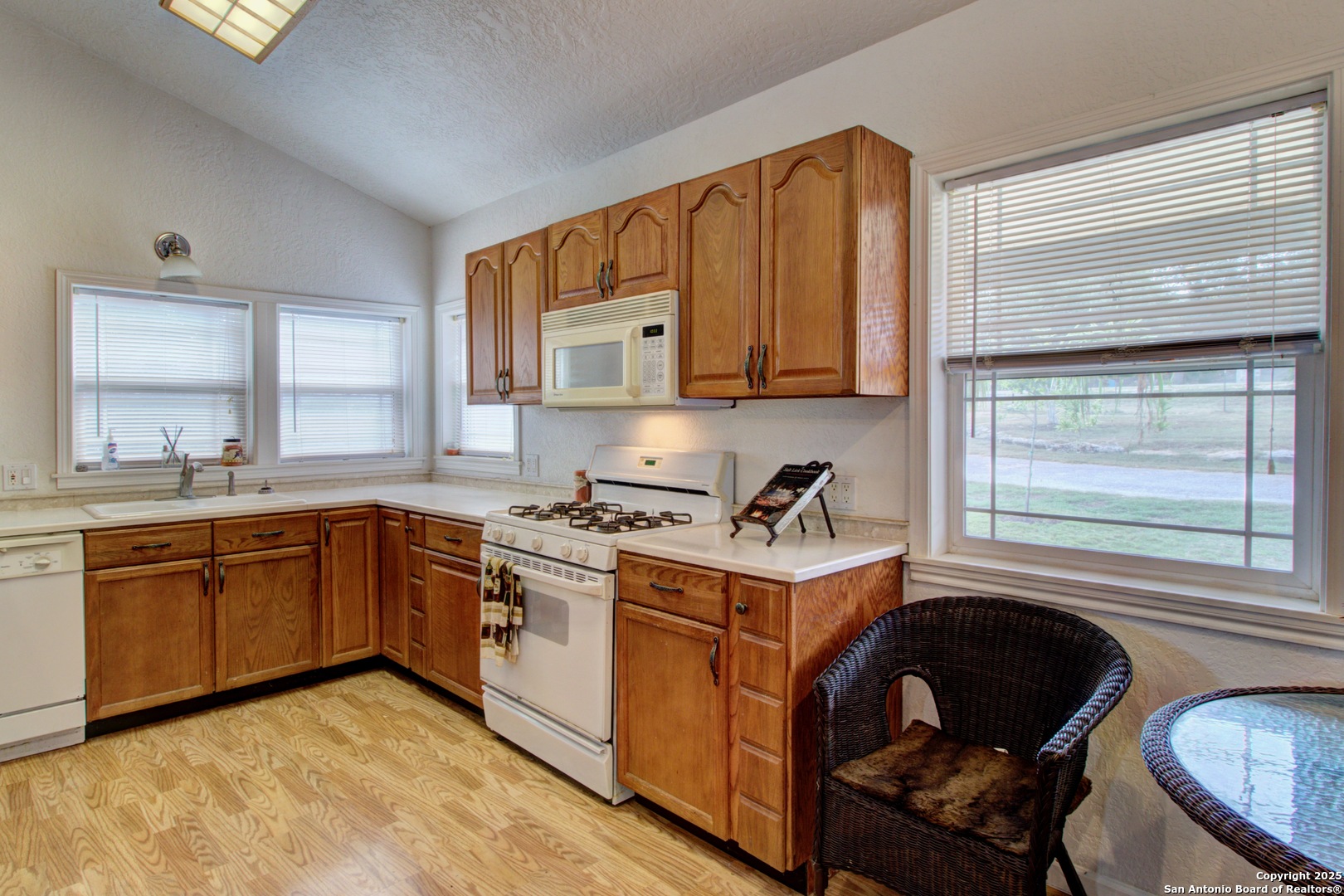 6248 Yorkshire Drive Spring Branch, TX 78070 - Photo 4 of 28 a kitchen with a stove a sink and a window