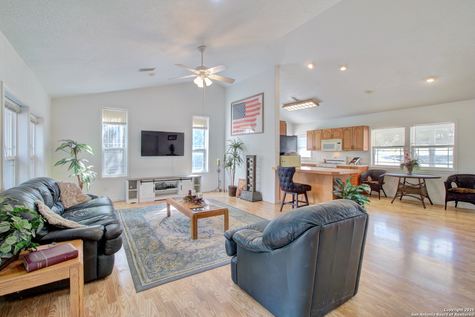 6248 Yorkshire Drive Spring Branch, TX 78070 - Photo 8 of 28 a living room with fireplace furniture and a flat screen tv
