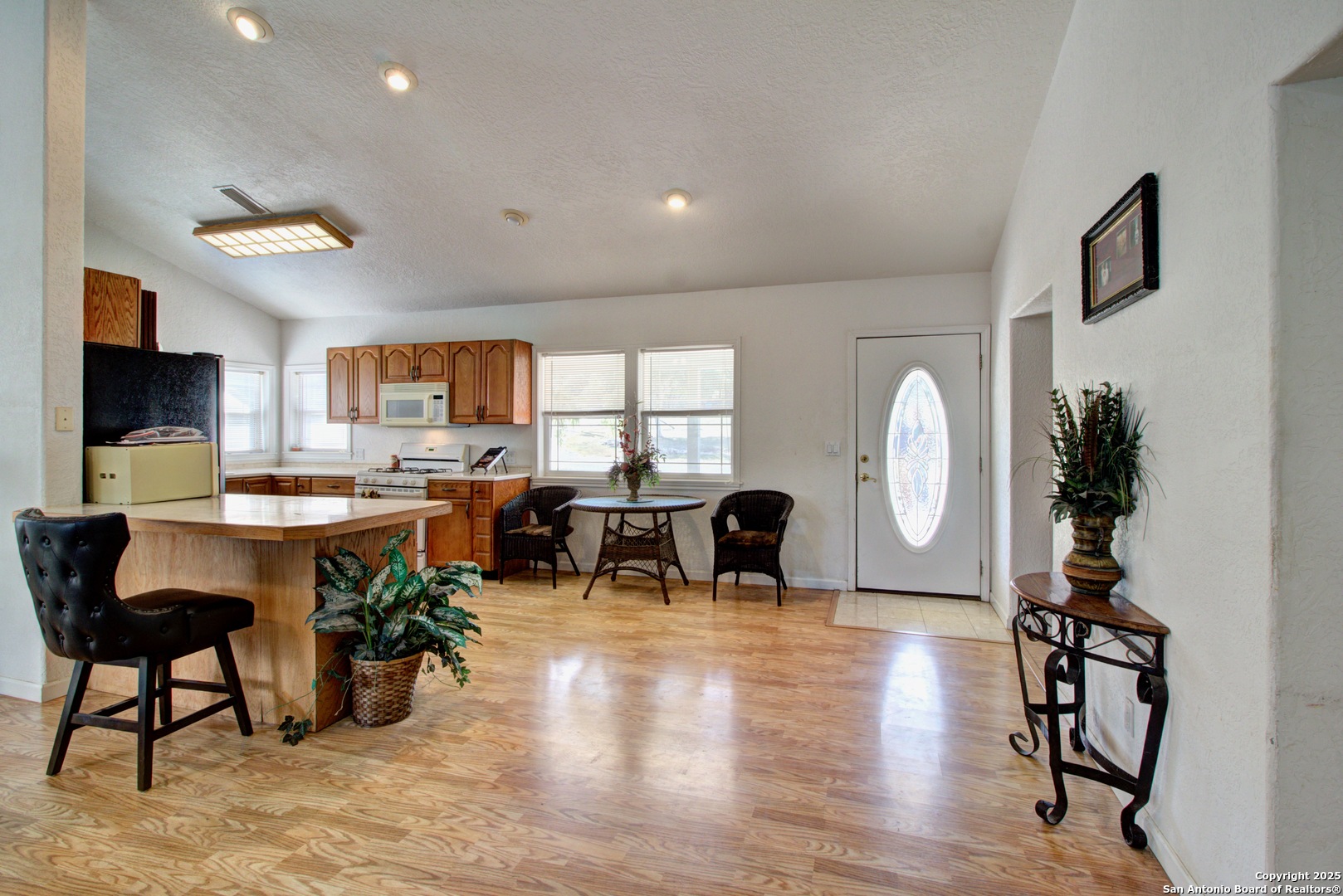6248 Yorkshire Drive Spring Branch, TX 78070 - Photo 9 of 28 a living room with furniture a dining table and a large window
