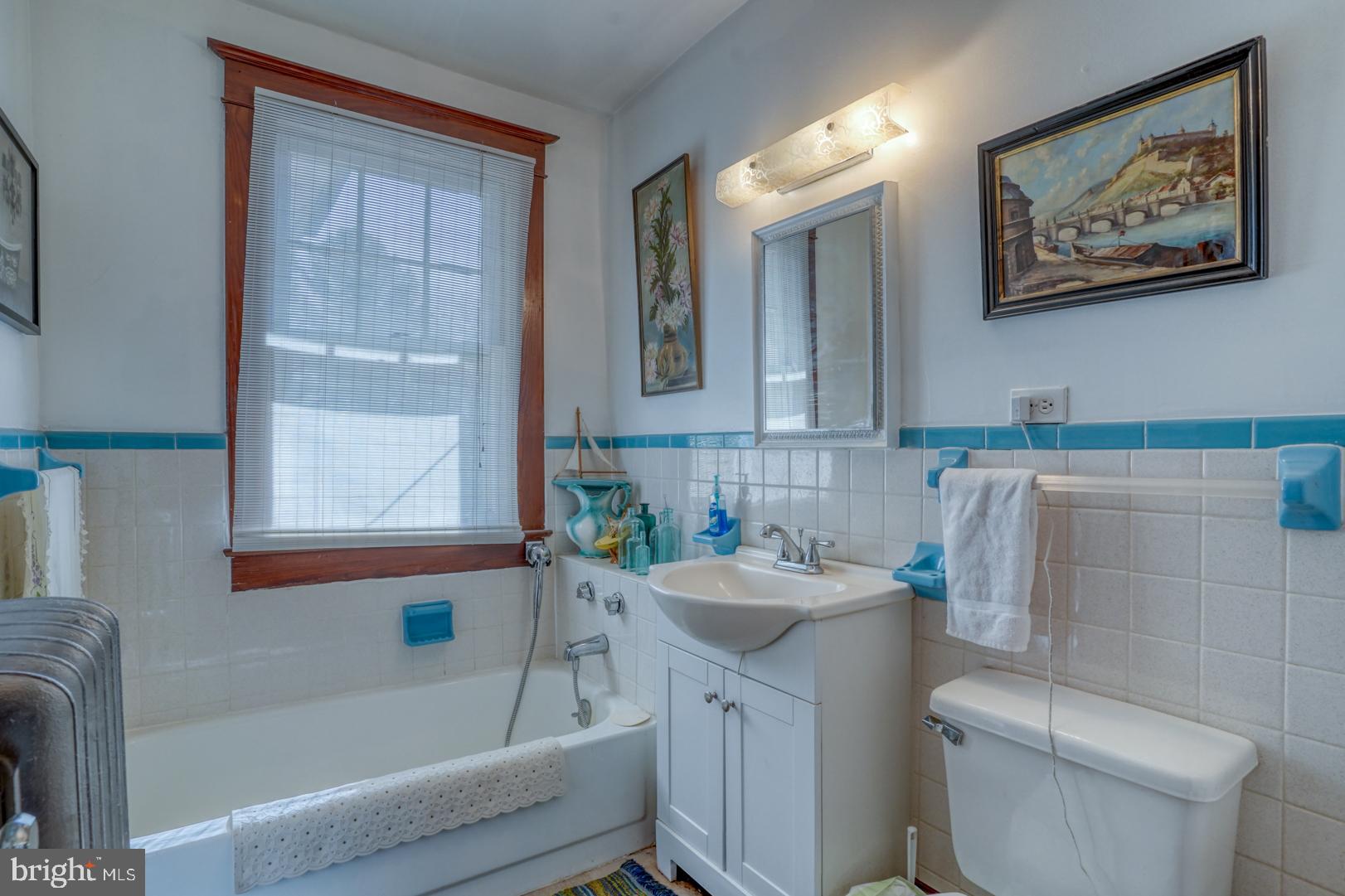 4096 Main Street Trappe, MD 21673 - Photo 52 of 70 a bathroom with a sink a toilet and shower