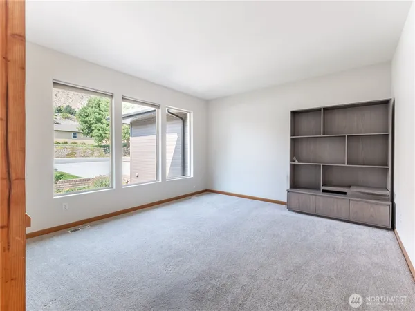 a kitchen with stainless steel appliances granite countertop sink stove top oven and refrigerator