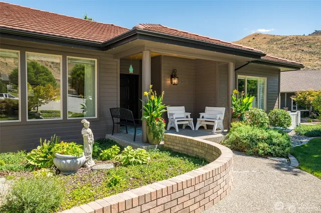 a front view of house with outdoor seating