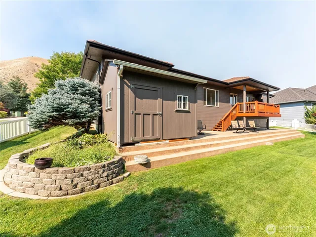 a view of residential houses with yard and swimming pool