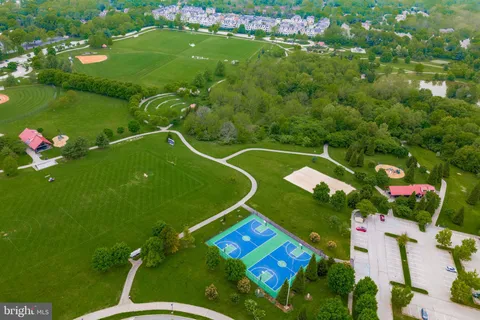 an aerial view of residential house with outdoor space and swimming pool