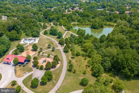 an aerial view of residential houses and outdoor space