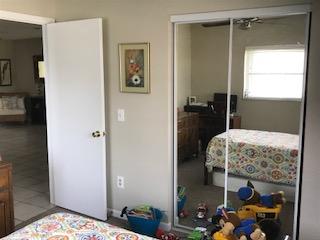 10907 Gable Street Boca Raton, FL 33428 - Photo 37 of 40 a bedroom with a bed and a mirror
