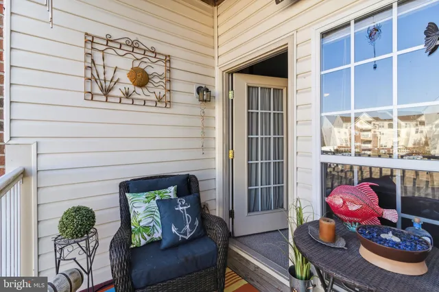 a front view of a house with outdoor seating