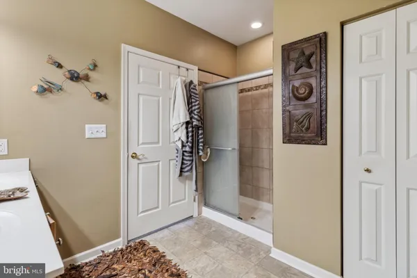 a bathroom with a shower and a sink