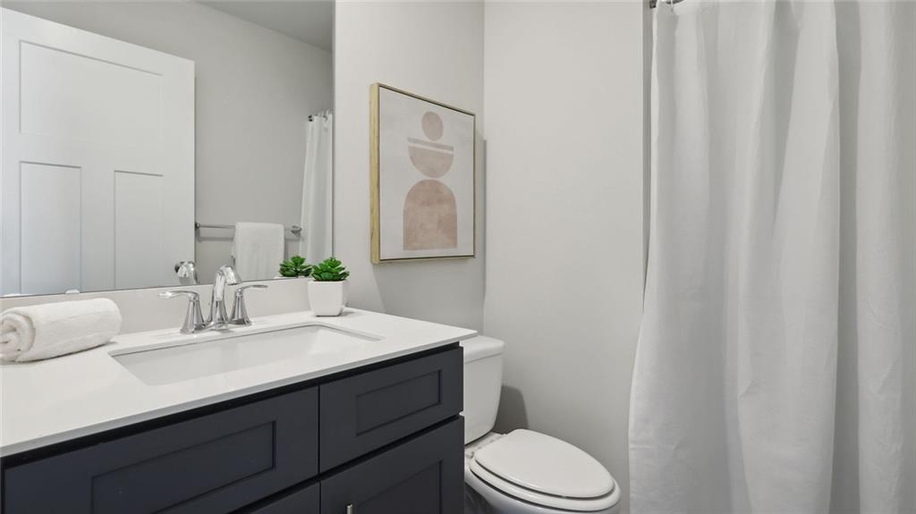 540 Cooper Street Wexford, PA 15090 - Photo 19 of 19 a bathroom with a sink vanity mirror and toilet