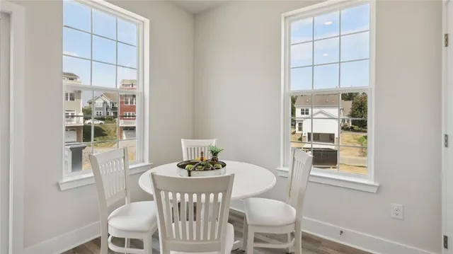 a dining room with furniture and window