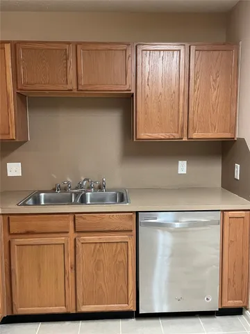 a kitchen with stainless steel appliances granite countertop a sink and a microwave