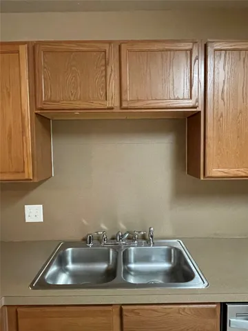 a view of room with walk in closet and bathroom