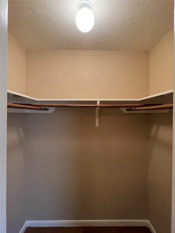 a bathroom with a sink mirror and shower