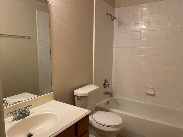 a bathroom with a sink a toilet and a bathtub